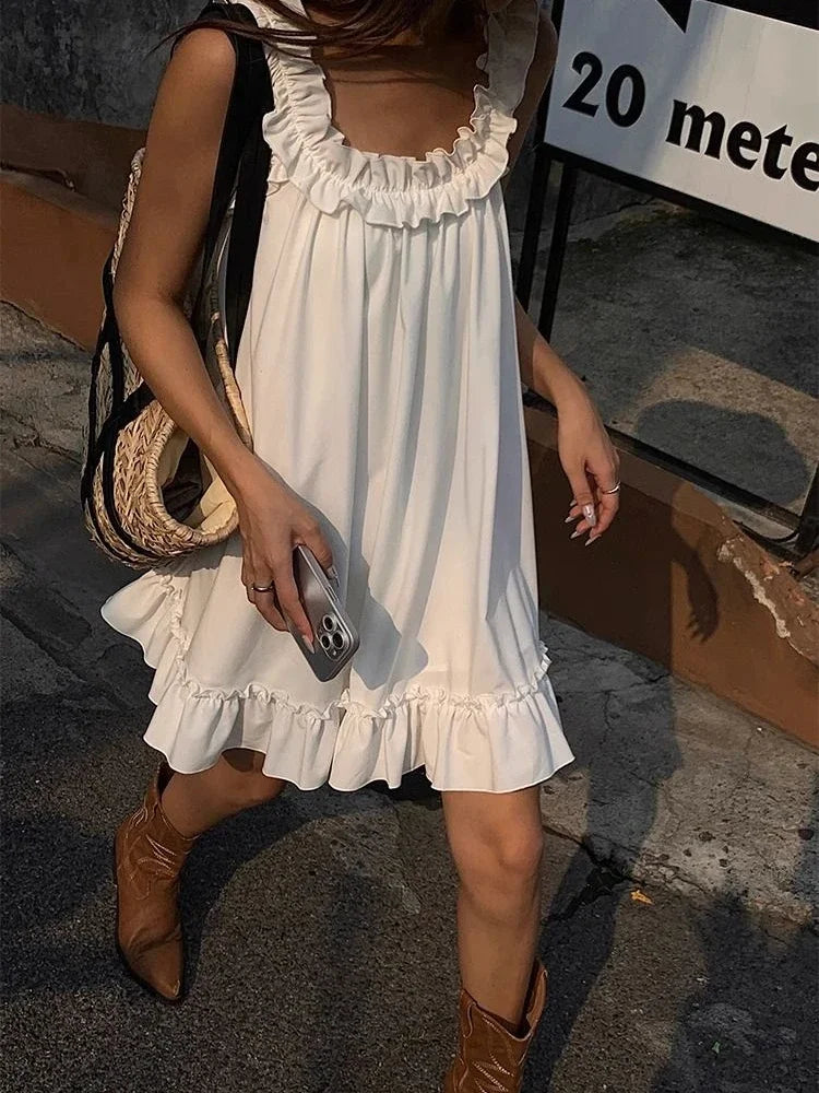 Girlary Women Casual Sleeveless Ruffles Mini Dress White Boho Beach Sundress Cute Girl Home Dresses Loose Summer Dress Oversized Trendy Crossover Mini Dress